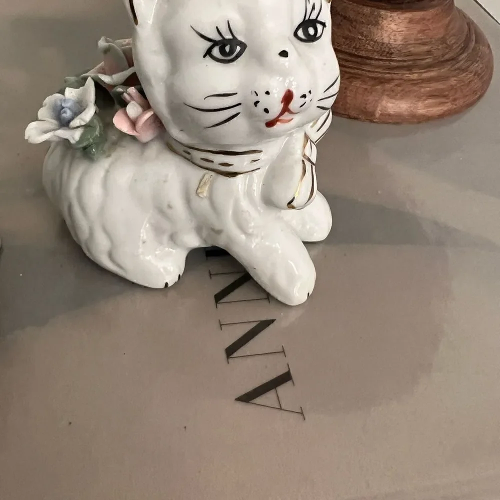 Set of two vintage small ceramic white and floral cats.
